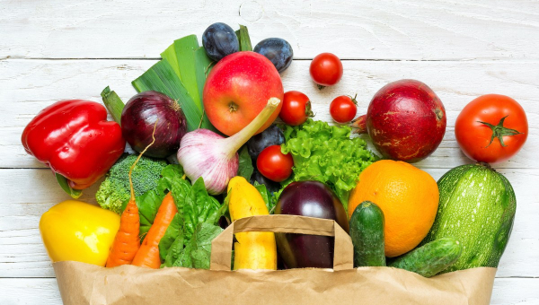 Grocery bag of fruits and vegetables to boost fertility